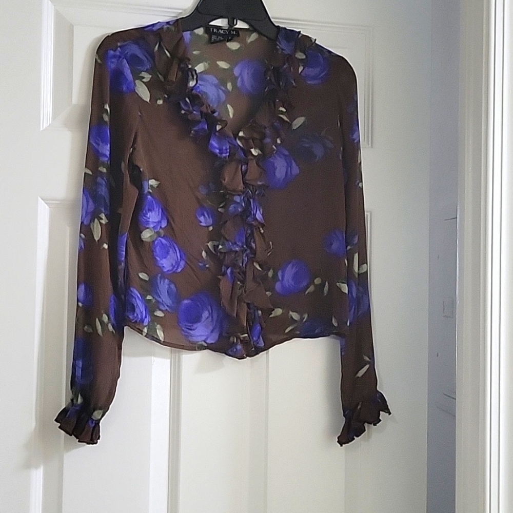 Silk, blue floral,w/green leaves, fancy button down front,long sleeve blouse.
